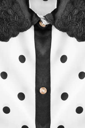 White with black polka dots blouse collar as a backgroundの写真素材