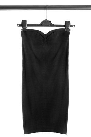 Black dress on clothes rack isolated over whiteの写真素材