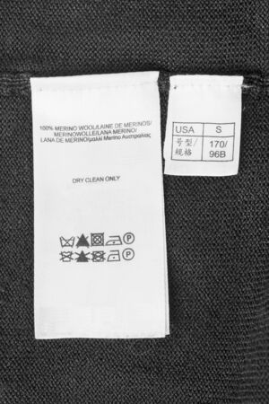 White clothes label on black wool as a backgroundの写真素材