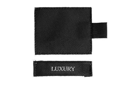 Black clothes label lettered luxury on white backgroundの写真素材
