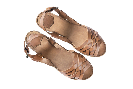 Brown leather flat sandals isolated over whiteの写真素材