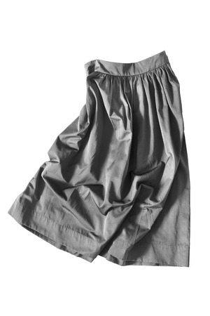 Crumpled gray skirt on white backgroundの写真素材