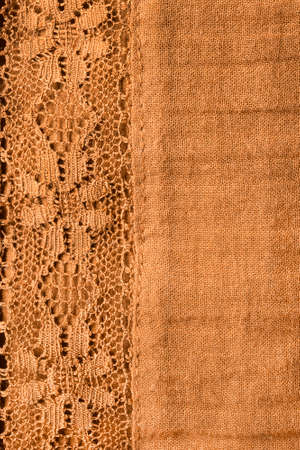 Yellow lacy cloth closeup as a backgroundの写真素材