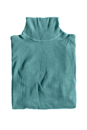 Folded blue pullover isolated over whiteの写真素材