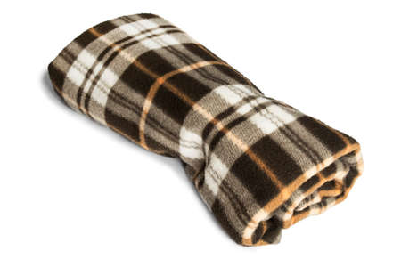 Brown fleece plaid folded on white backgroundの写真素材