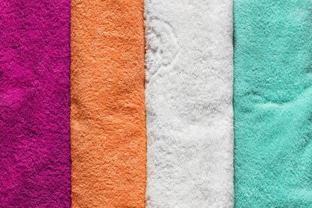 Group of colorful terry towels as a backgroundの写真素材