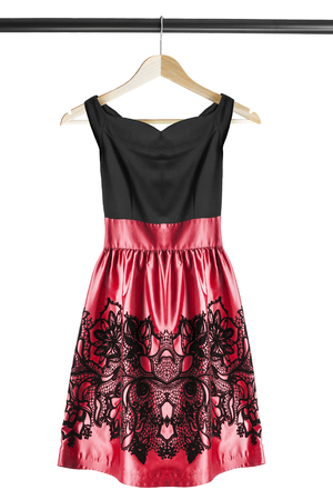 Cocktail dress on wooden clothes rack isolated over whiteの写真素材