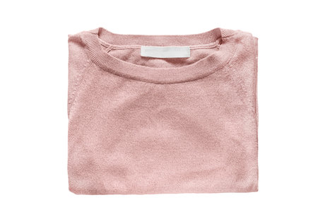 Elegant pink pullover folded on white backgroundの写真素材