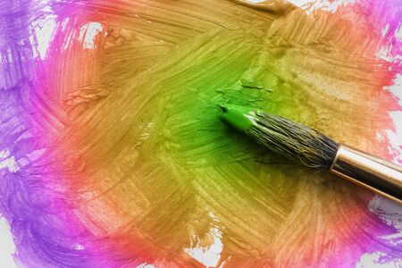 Colorful painting and painting brush as a backgroundの写真素材