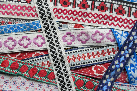 Ethnic embroidered laces closeup as a backgroundの写真素材