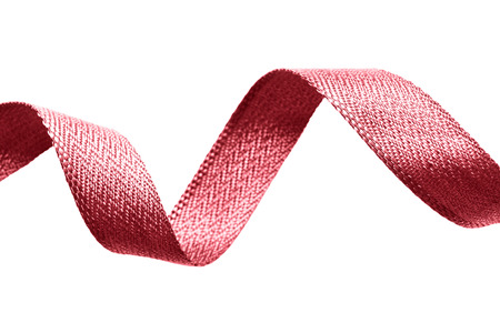 Red silk decorative ribbon on white backgroundの写真素材