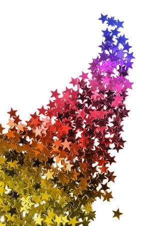 Colorful stars shaped confetti scattered on white backgroundの写真素材