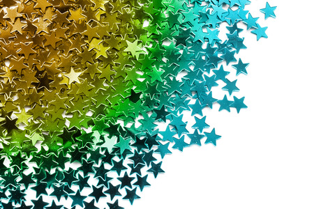 Colorful metallic confetti on white backgroundの写真素材
