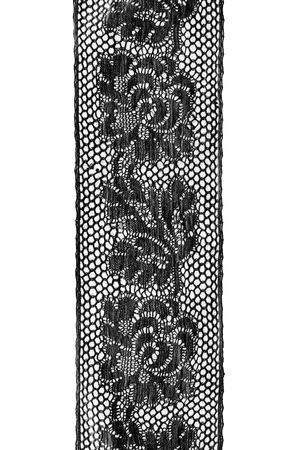 Strip of black vintage lace on white backgroundの写真素材