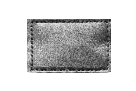 Black blank leather label isolated over whiteの写真素材
