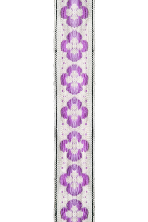 Pink embroidered decorative ribbon on white backgroundの写真素材