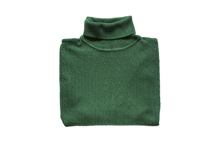 Green wool sweater folded on white backgroundの写真素材
