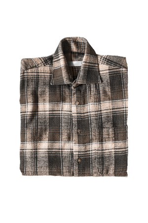 Brown tartan shirt folded on white backgroundの写真素材