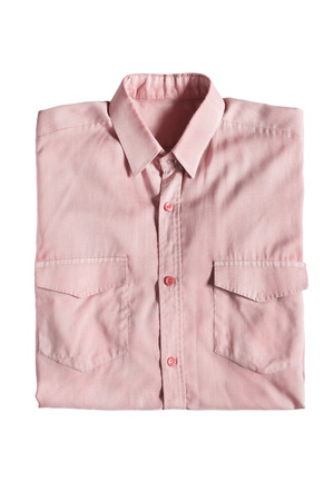 Folded pink classic shirt isolated over whiteの写真素材