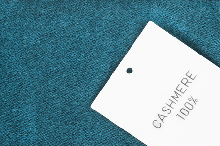 Fabric composition label on blue cashmere backgroundの写真素材