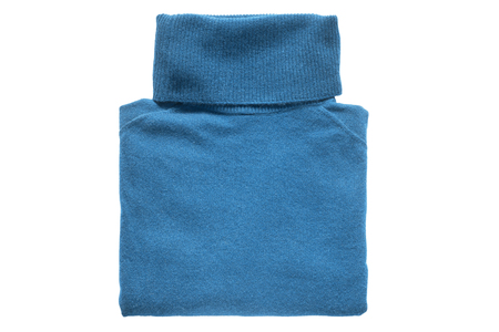 Folded blue cashmere sweater isolated over whiteの写真素材