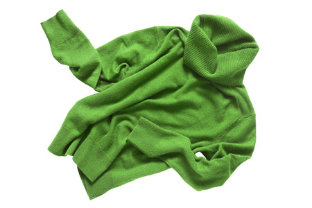 Green cashmere crumpled sweater on white backgroundの写真素材