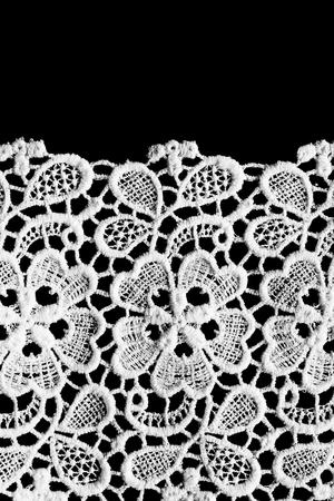 Vintage white cotton lace isolated over blackの写真素材