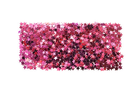 Rectangle pile of pink star shaped confetti isolated over whiteの写真素材