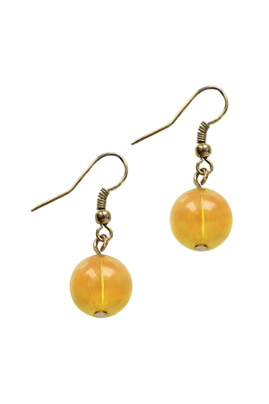 Pair of amber earrings isolated over whiteの写真素材