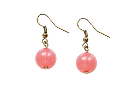 Pink quartz golden earrings on white backgroundの写真素材