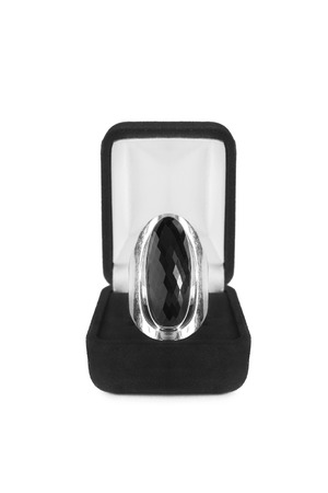Black onyx ring in jewel box isolated over whiteの写真素材