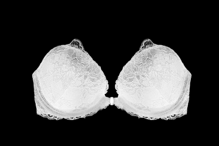White lacy strapless push up bra on black backgroundの写真素材