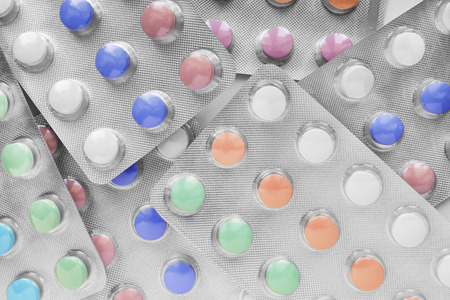 A lot of colorful pills closeup as a backgroundの写真素材