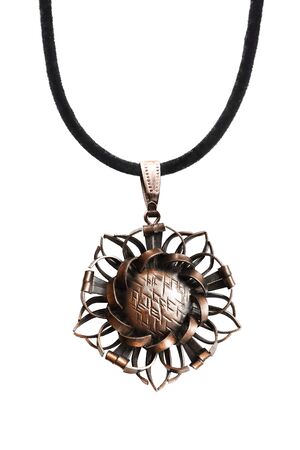 Vintage bronze pendant on black lace isolated over whiteの写真素材