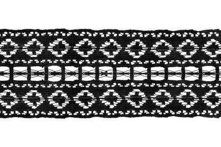 Black vintage decorative lacy ribbon on white backgroundの写真素材