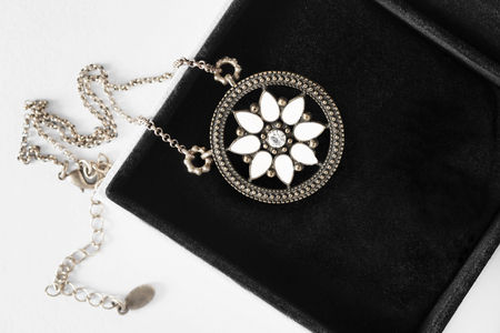 Bronze medallion with single diamond in jewel box closeupの写真素材