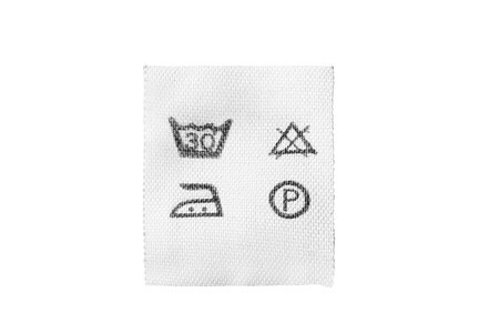 Washing instructions textile clothes label isolated over whiteの写真素材