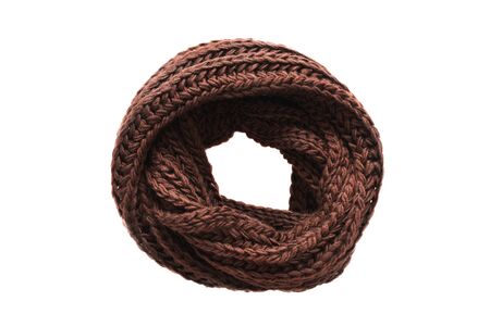 Folded brown wool knitted scarf isolated over whiteの写真素材
