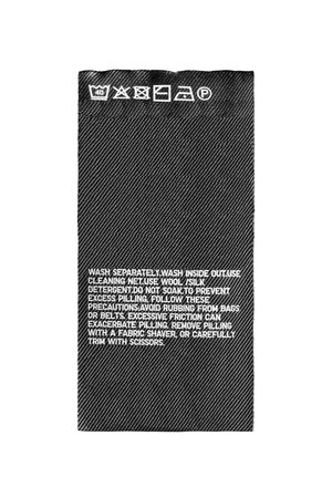 Washing instructions textile clothes label isolated over white