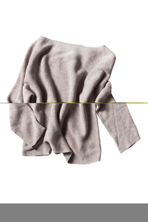 Crumpled knntted oversized sweatshirt isolated over whiteの写真素材