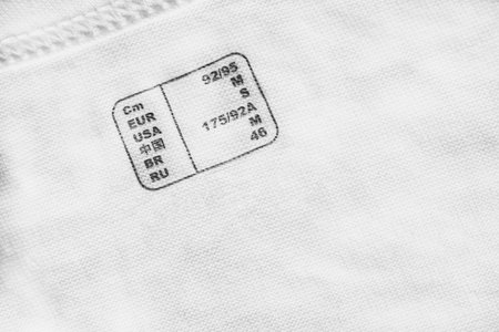 International clothes size table printed on white cottonの写真素材