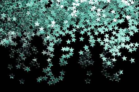 Abstract blue silver stars confetti isolated over blackの写真素材