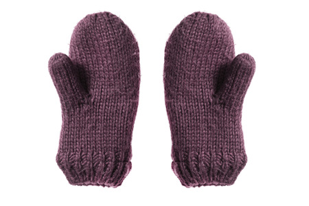 Pair of warm knitted mittens isolated over whiteの写真素材
