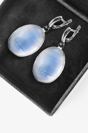 Pair of elegant aquamarine earrings in black jewel box closeupの写真素材