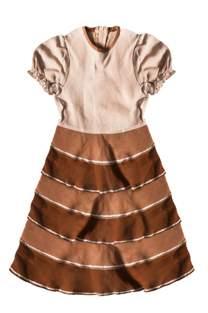 Beige dress with brown ruches skirt isolated over whiteの写真素材