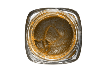 Cosmetics face scrub in opened glass jar isolated over whiteの写真素材