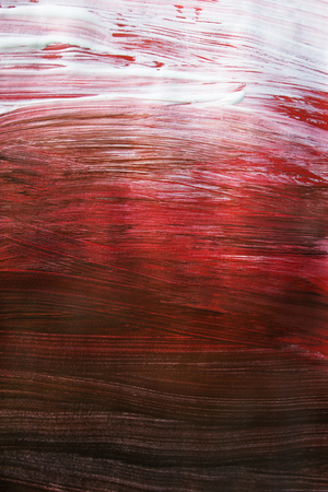 Abstract acrylic painting in shades of red and white as a backgroundの写真素材