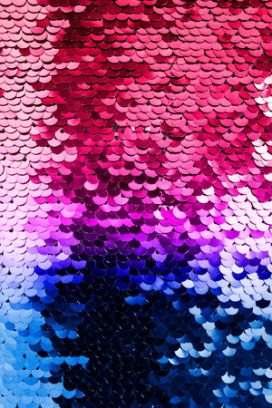 Colorful metallic sparkling scales sequins as a background closeup