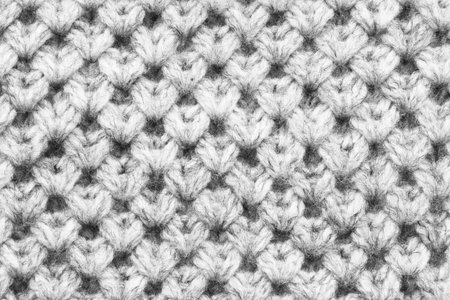 White knitted wool texture closeup as a background