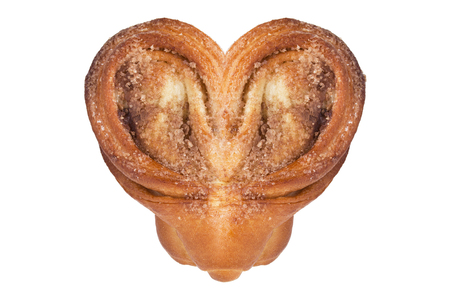 Sweet cinnamon bun on white background closeupの写真素材